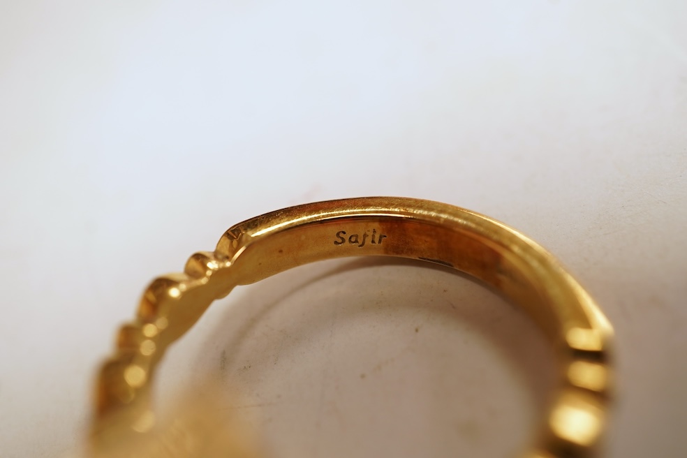 A cubic zirconia and diamond ring, set with a marquise-shaped blue cubic zirconia, to shoulders set with brilliant-cut diamonds, mounted in gold, size Q1/2, stamped 585, gross weight 8 grams, Condition: minor discolorati